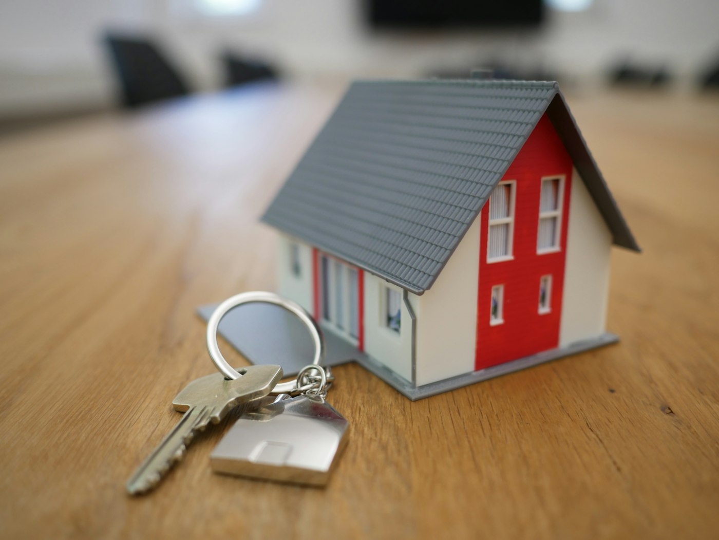 Model house and keys representing a real estate closing